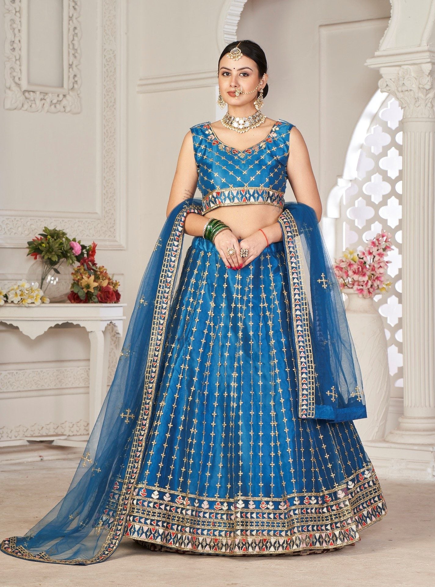Graceful Teal Blue Embroidered Festive & Wedding Wear Semi-Stitched Net Lehenga Choli with Net Dupatta