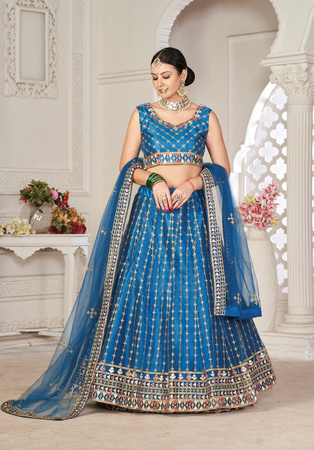 Graceful Teal Blue Embroidered Festive & Wedding Wear Semi-Stitched Net Lehenga Choli with Net Dupatta