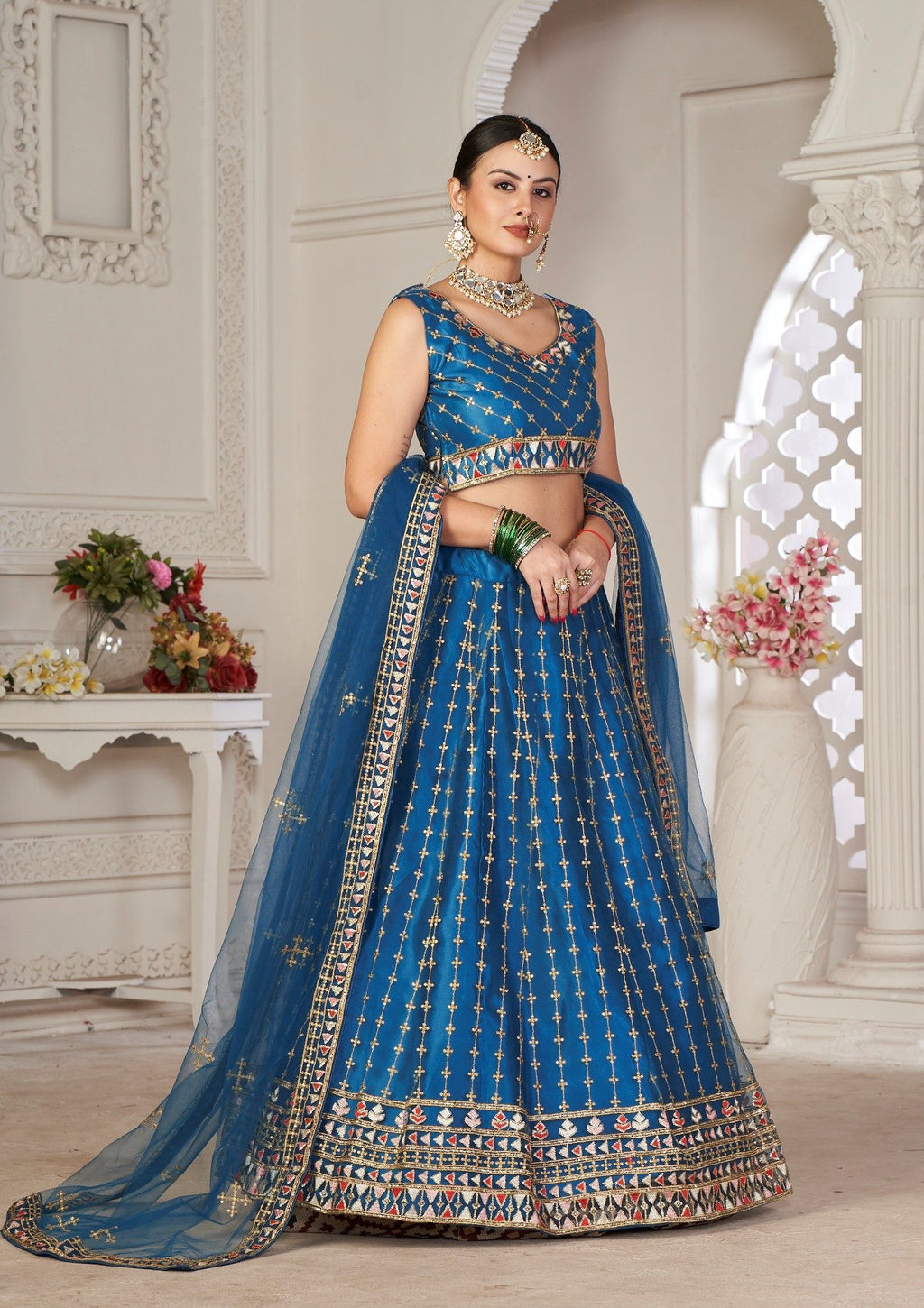Graceful Teal Blue Embroidered Festive & Wedding Wear Semi-Stitched Net Lehenga Choli with Net Dupatta