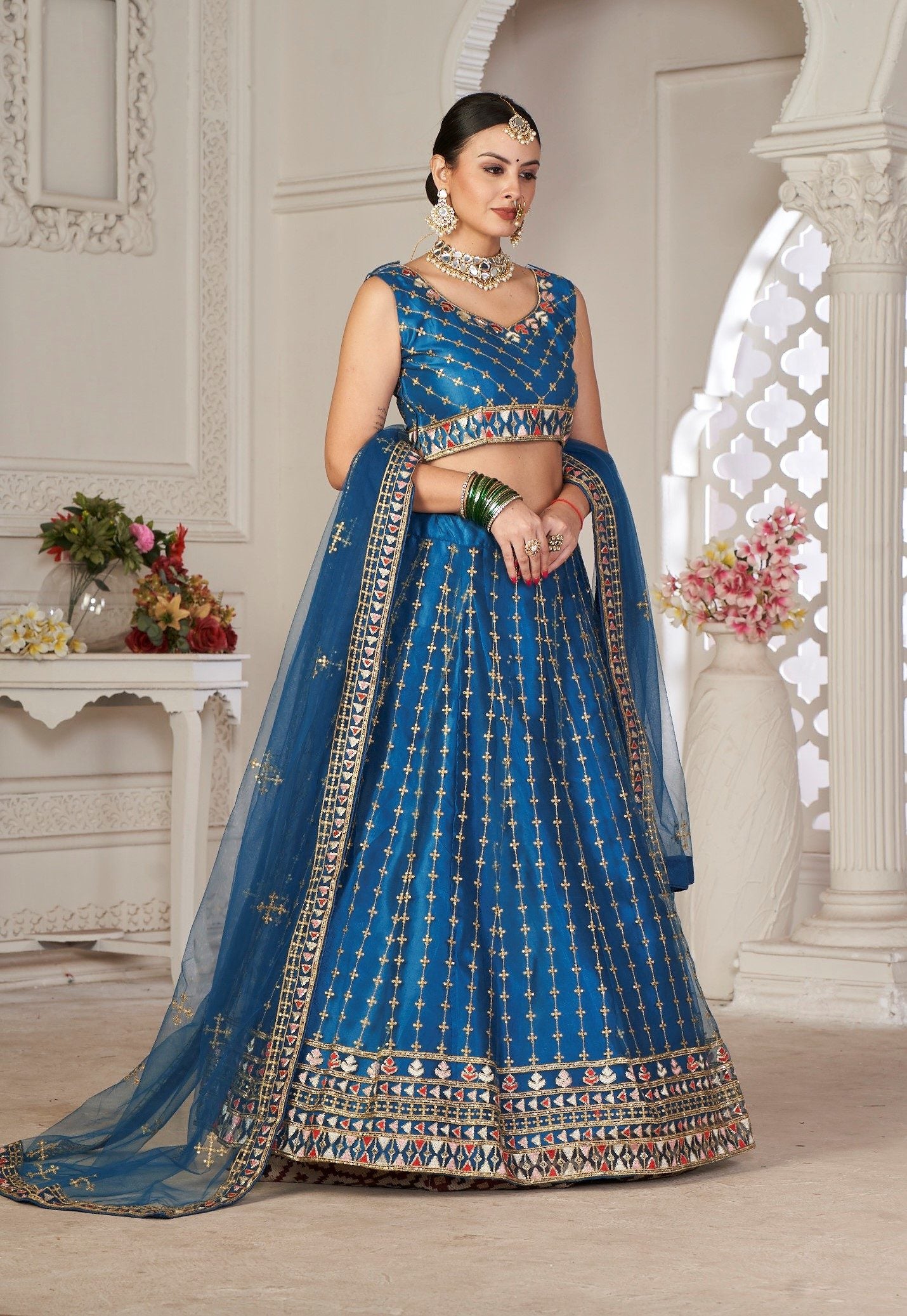 Graceful Teal Blue Embroidered Festive & Wedding Wear Semi-Stitched Net Lehenga Choli with Net Dupatta