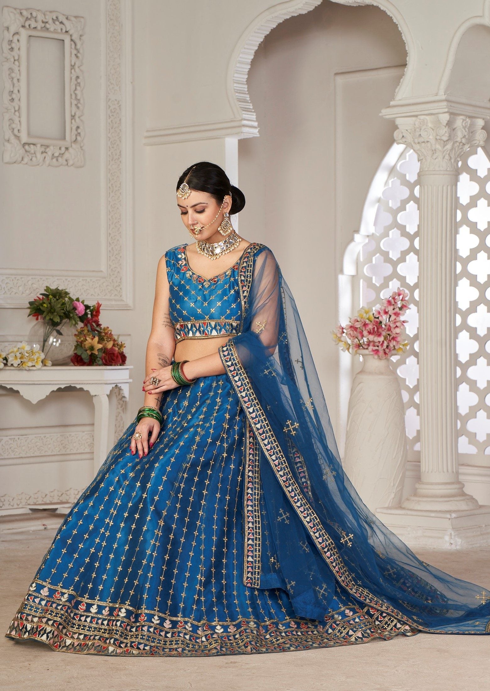 Graceful Teal Blue Embroidered Festive & Wedding Wear Semi-Stitched Net Lehenga Choli with Net Dupatta