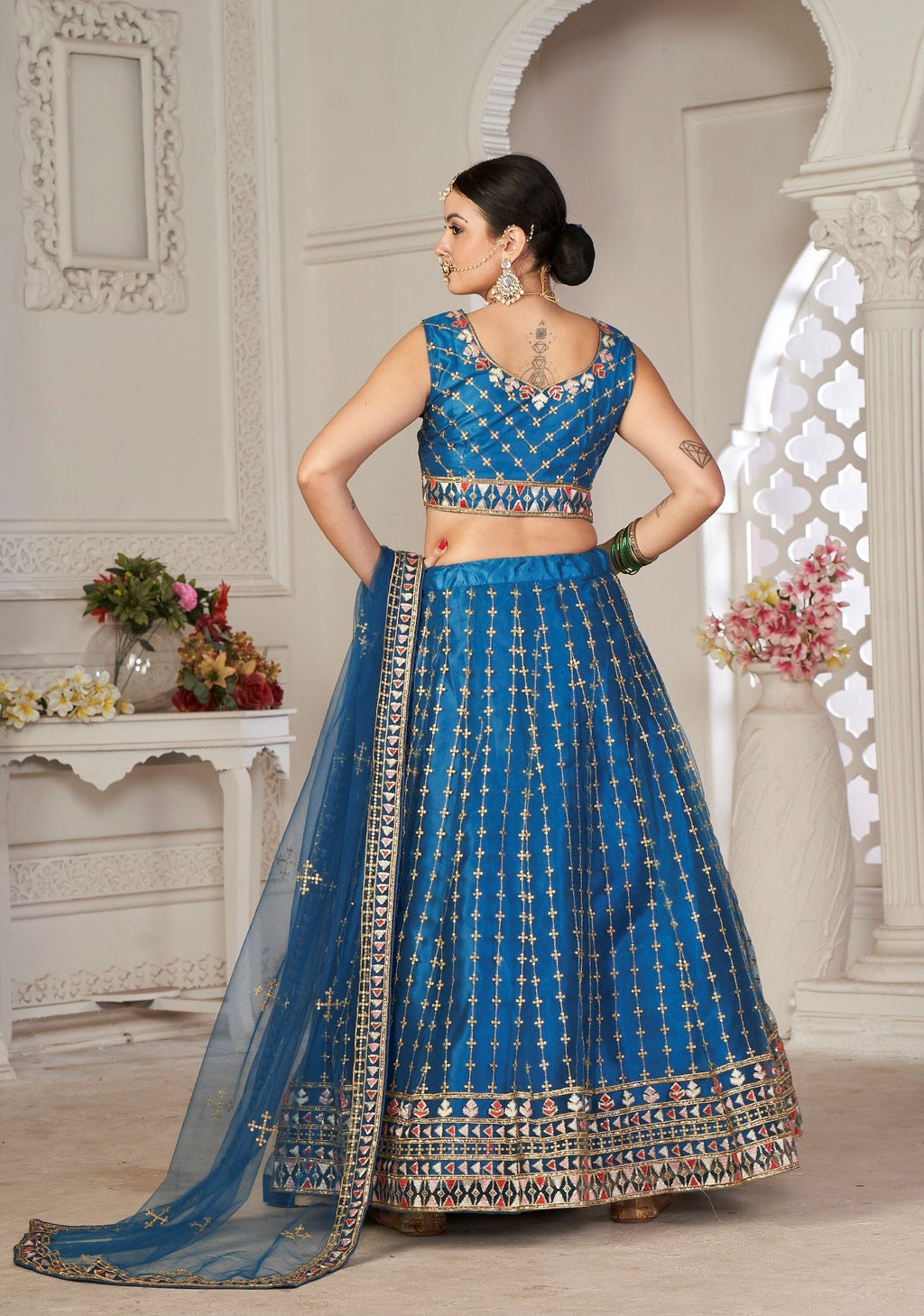 Graceful Teal Blue Embroidered Festive & Wedding Wear Semi-Stitched Net Lehenga Choli with Net Dupatta