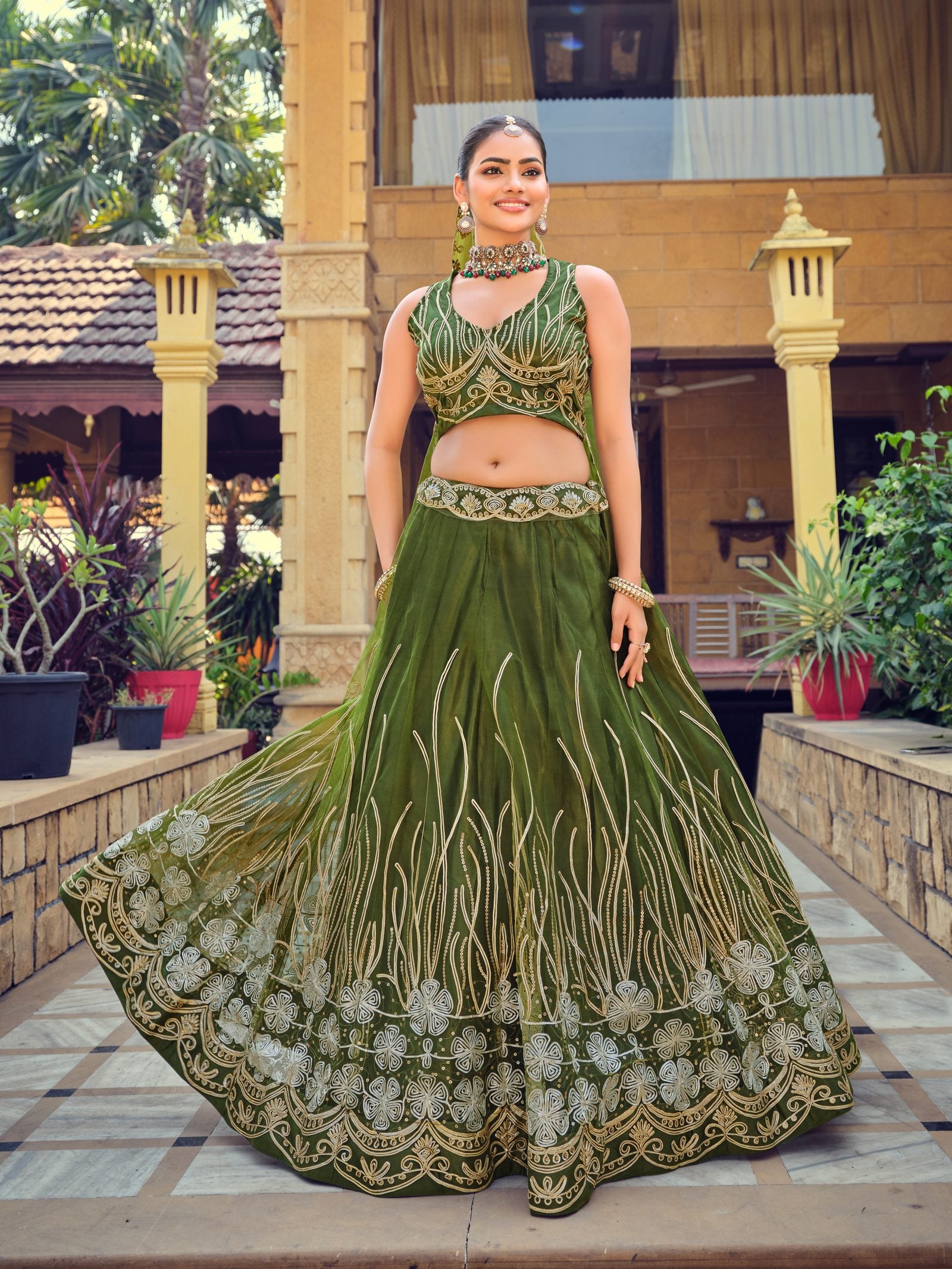 Dark Green Zari & Thread Embroidered Wedding Wear Semi-Stitched Net Lehenga Choli with Heavy Border Work