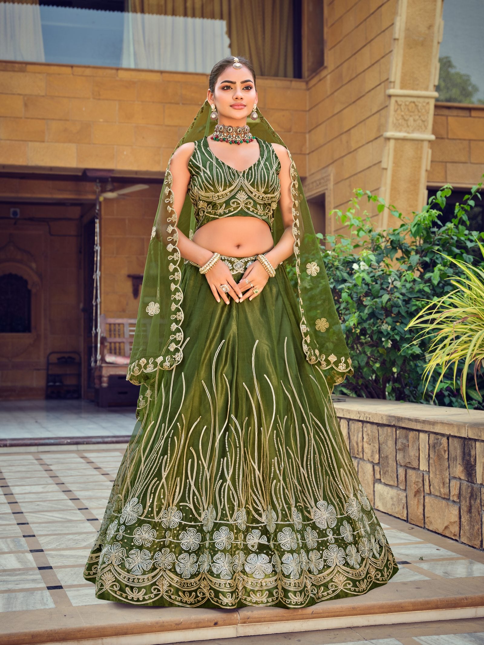 Dark Green Zari & Thread Embroidered Wedding Wear Semi-Stitched Net Lehenga Choli with Heavy Border Work