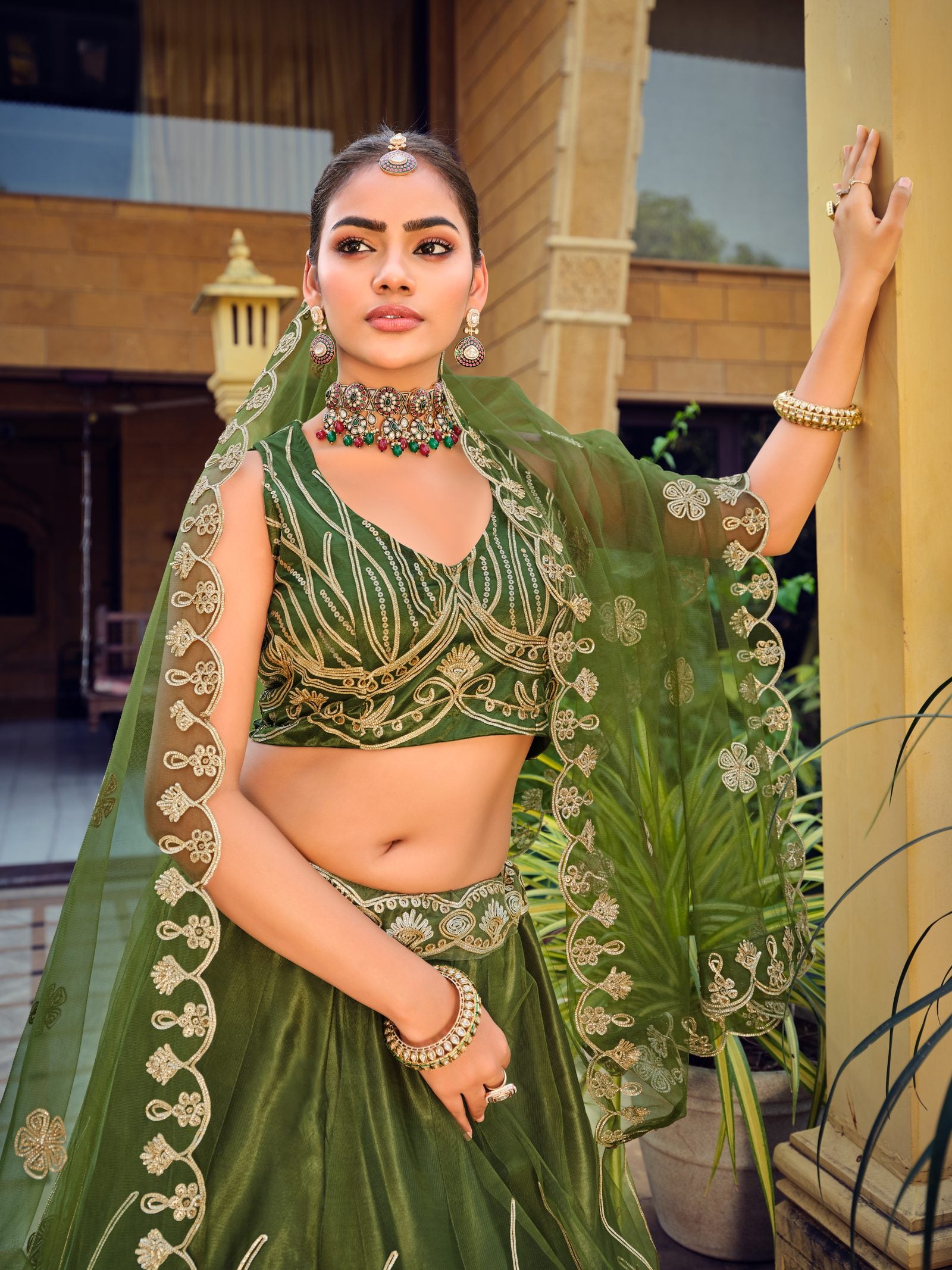 Dark Green Zari & Thread Embroidered Wedding Wear Semi-Stitched Net Lehenga Choli with Heavy Border Work