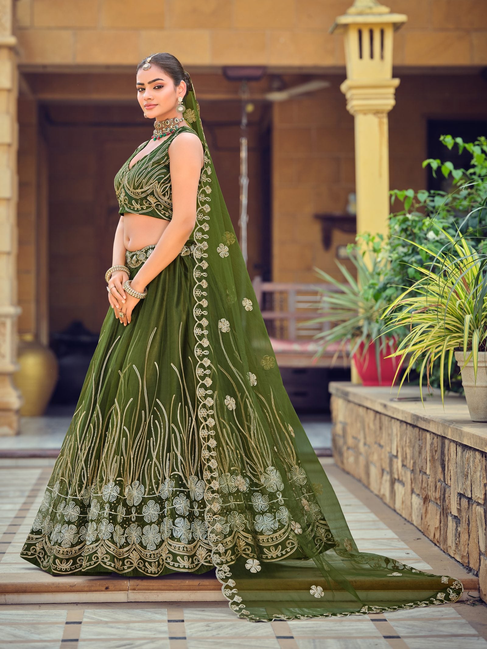 Dark Green Zari & Thread Embroidered Wedding Wear Semi-Stitched Net Lehenga Choli with Heavy Border Work