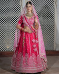 Motif Pattern Embroidered Semi- Sticth Rani Pink Silk Bridal Lehenga Choli with Net Dupatta