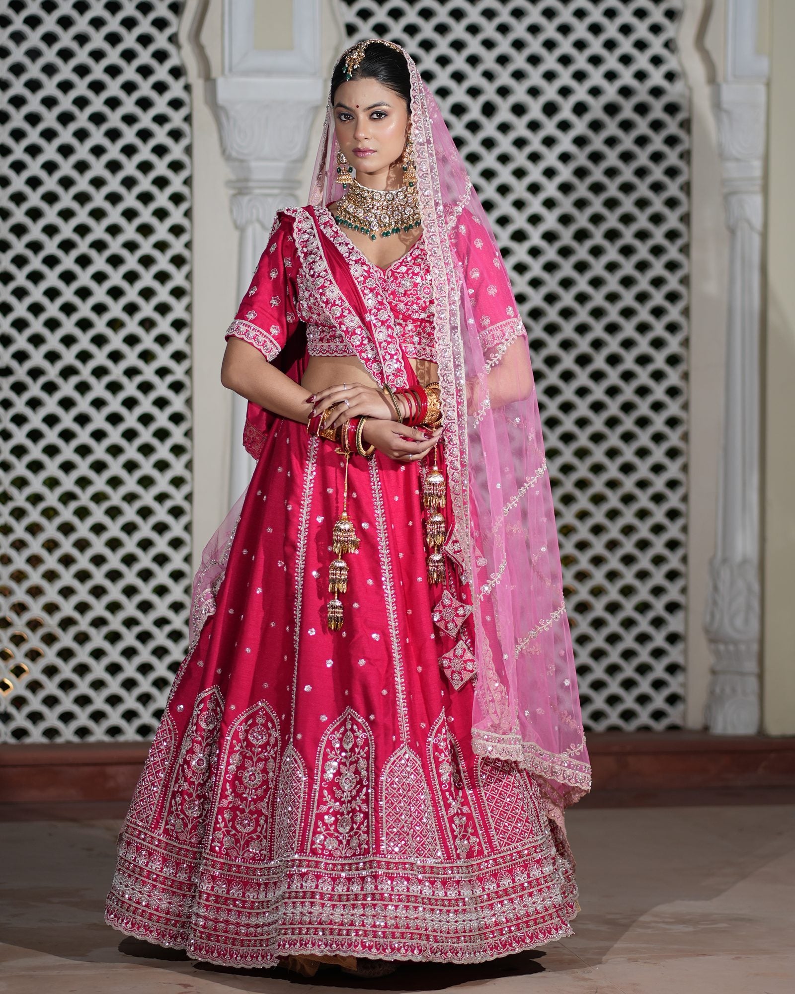 Motif Pattern Embroidered Semi- Sticth Rani Pink Silk Bridal Lehenga Choli with Net Dupatta