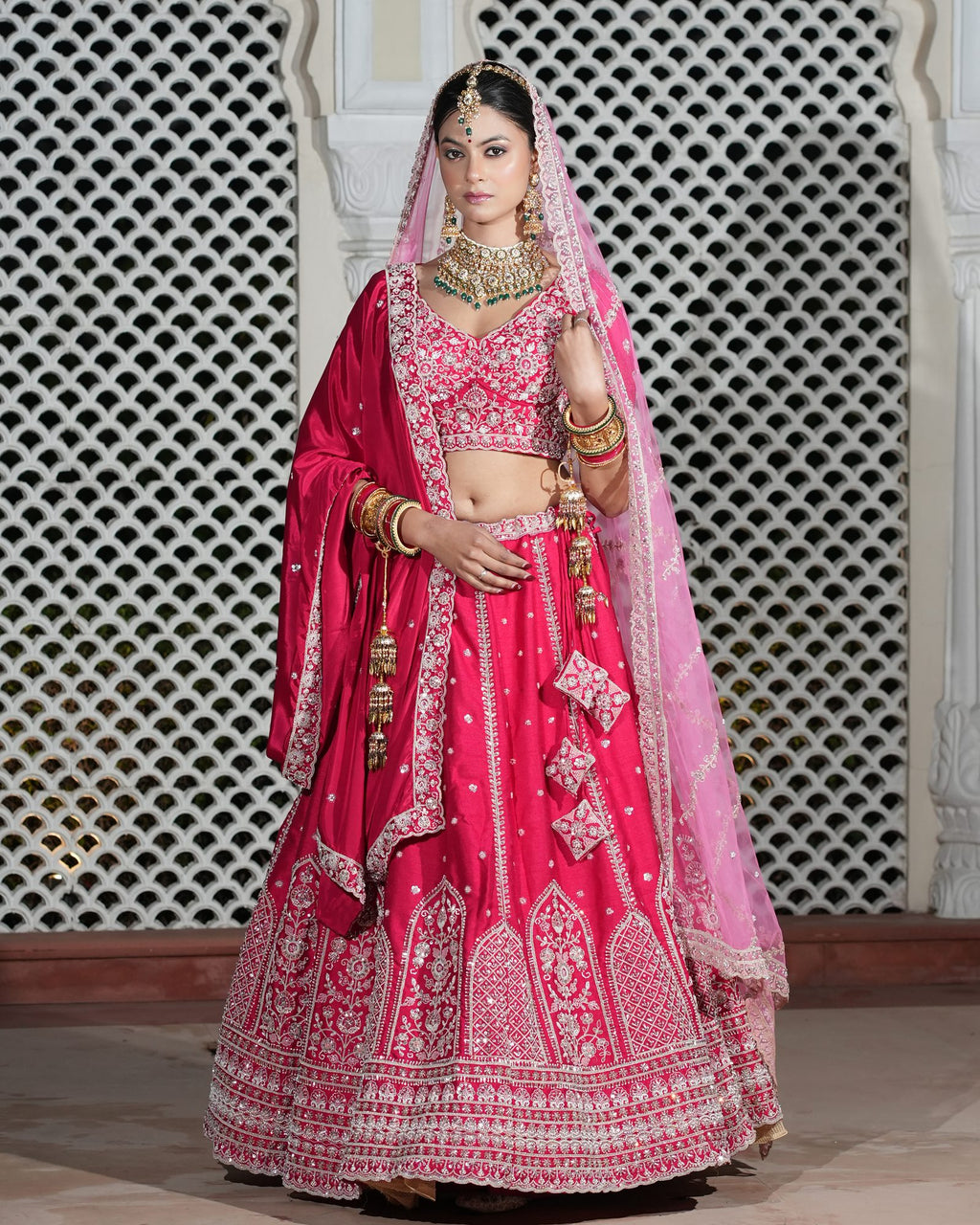 Motif Pattern Embroidered Semi- Sticth Rani Pink Silk Bridal Lehenga Choli with Net Dupatta