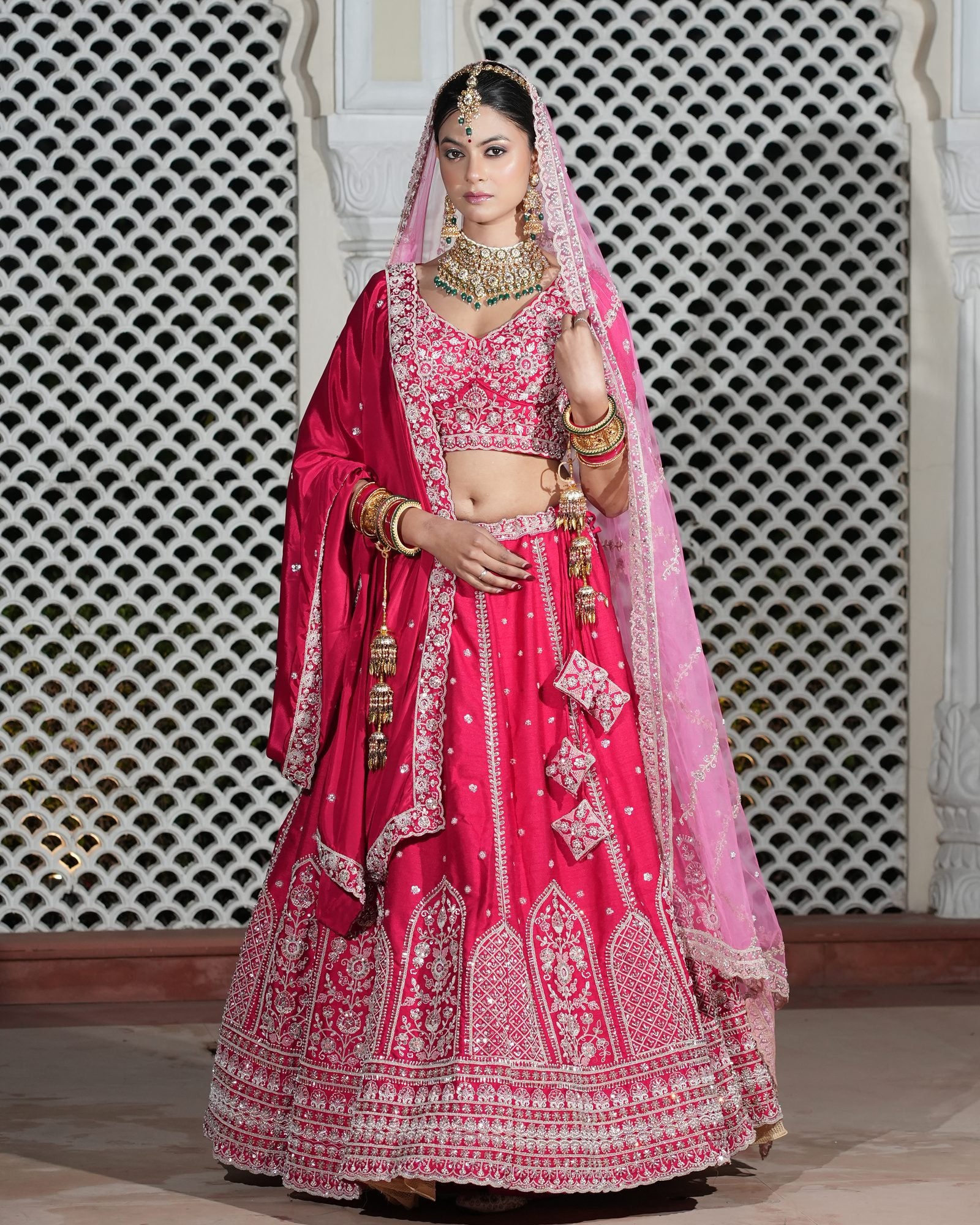 Motif Pattern Embroidered Semi- Sticth Rani Pink Silk Bridal Lehenga Choli with Net Dupatta