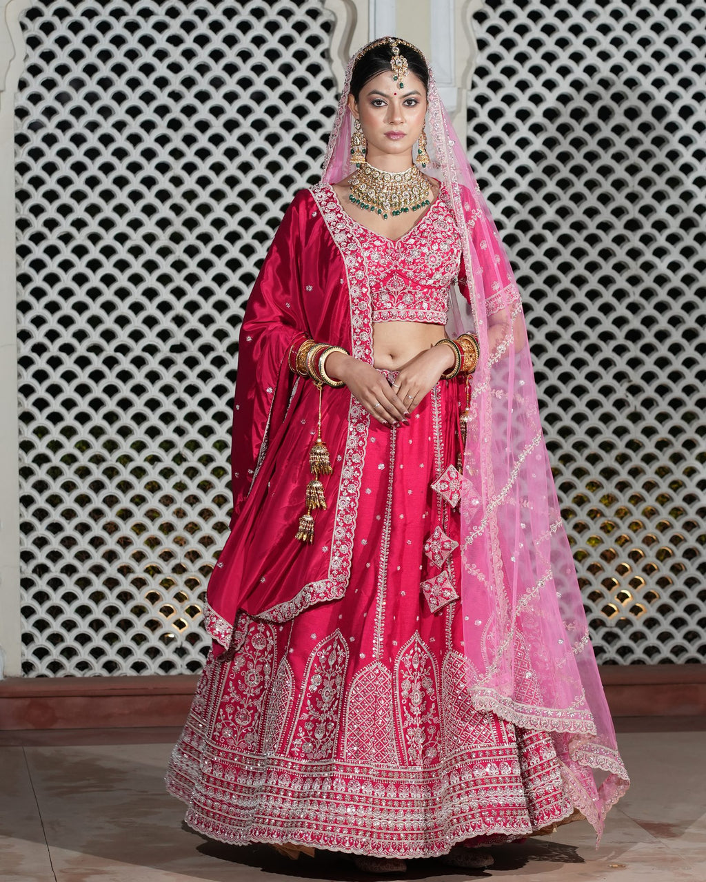 Motif Pattern Embroidered Semi- Sticth Rani Pink Silk Bridal Lehenga Choli with Net Dupatta