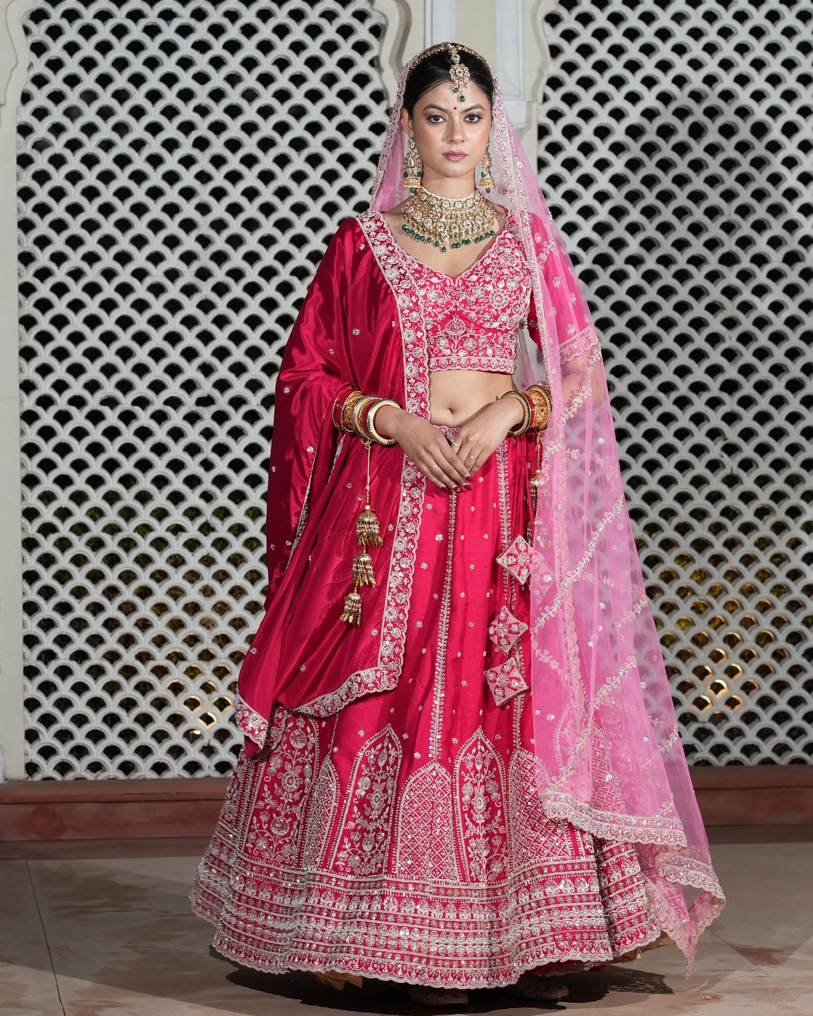 Motif Pattern Embroidered Semi- Sticth Rani Pink Silk Bridal Lehenga Choli with Net Dupatta